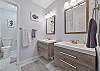 Two separate vanities and a spacious walk-in shower in the primary bathroom