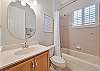 A shower-tub combo in the guest bathroom