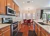 Fully equipped kitchen with breakfast bar and dining nook. The kitchen is equipped with a  UV filter to a separate tap and the fridge