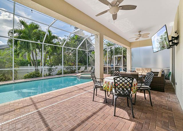 Enjoy the gorgeous screened in pool area with heated pool and spa. The lanai has a grilling station with hibachi grill, smoke burner, beverage center, bar, a seating, outdoor dining and sun lounging areas as well as a TV. 