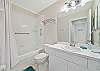 A shower-tub combo in the guest bedroom