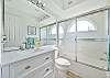 A shower-tub combo in the guest bathroom