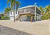 Barefoot Bonita, a 3 bedroom 3 bathroom vacation beach house steps away from the beach and bay with 2 docks and shallow boat ramp