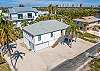 Barefoot Bonita, a 3 bedroom 3 bathroom vacation beach house steps away from the beach and bay with 2 docks and shallow boat ramp