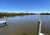 The common owned area at the east bay-end of the street with boat ramp for kayaks and pontoon boats (shallow), 2 docks and bench is the perfect spot to watch dolphins play while drinking your morning coffee