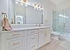 A shower-tub combo in the guest bathroom