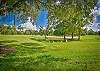 The screened in patio offers a beautiful view overlooking the Green