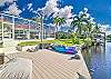 Cape Coral pool home with private dock. The canal offers River & Gulf access. Kayaks size M and L to use with waiver