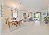 Spacious living with flat screen TV and dining area