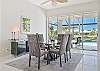 The dining room offers beautiful pool and lake view