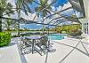 The large pool deck offers outdoor dining, lounging areas and covered seating.