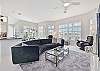 The family room offers beautiful pool and lake view
