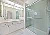 A spacious shower in the guest bathroom