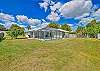 Spacious yard with screened in pool area