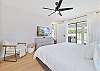 The primary suite is equipped with a king size bed and smart TV. Sliding door provide pool access