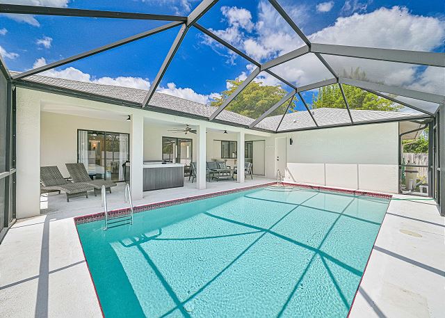 Private pool and separate hot tub overlooking the oversized garden.