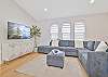 Family room with spacious sectional seating and smart TV
