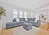 Family room with spacious sectional seating and smart TV