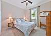 A queen bed and smart TV in the guest bedroom
