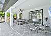 Covered outdoor seating & dining area with smart TV & BBQ