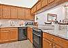 Fully equipped kitchen with breakfast nook and breakfast bar