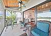 The screened in corner balcony with lake and golf course view allows a nice breeze