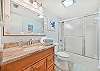A shower-tub combo in the guest bathroom