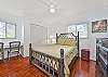 A queen bed and custom office nook in the guest bedroom