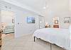 A king size bed and smart TV in the primary bedroom