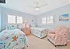 Two twin beds and smart TV in the third bedroom