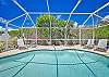 Plenty of lounge chairs and seating around the private landscaped heated pool. 