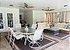 Outdoor dining & seating area, and the two comfortable chairs and footstools in the cove area make a perfect space for a nap or to enjoy a book