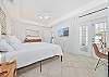 A king size bed and smart TV in the primary bedroom