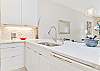 Fully equipped kitchen with bar seating