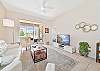 Living with TV and sliding doors to the screened in lanai