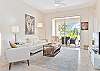 Living with TV and sliding doors to the screened in lanai