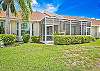 he screened in lanai faces west and offers a  gorgeous sunset golf course and lake view. 