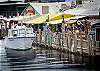 Enjoy a bite at the waterfront restaurants at Tin City