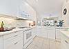 Fully equipped kitchen with bar seating 