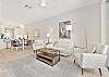 Living with TV and sliding doors to the screened in lanai
