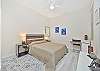 A queen bed in the guest bedroom