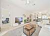 Living with TV and sliding doors to the screened in lanai
