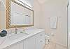 The en-suite primary bathroom is equipped with a shower