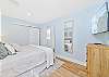 The second guest bedroom (downstairs) is equipped with a king bed and smart TV