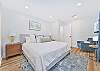 The first guest bedroom (downstairs) has the cabana bathroom en-suite, and is equipped with a king bed and smart TV