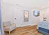 A king size bed, office nook and smart TV  in the upstairs primary bedroom