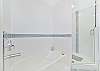 Dual sinks, a shower and separate tub in the upstairs primary bathroom