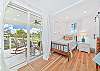 Two twin beds and a smart TV in the third bedroom. Sliding doors provide access to the balcony
