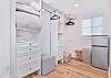 The primary bedroom offers a spacious walk-in closet with fridge. Great to enjoy a cool beverage for a romantic sunset view on the balcony!