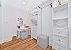 The primary bedroom offers a spacious walk-in closet with make-up desk